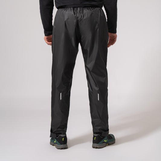 black waterproof overtrousers showing the shape from the back with a white background
